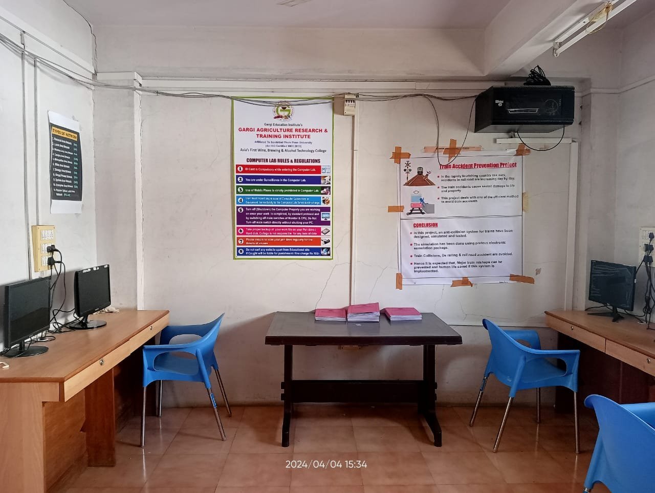 Students working on computer assignments in organized workstation rows