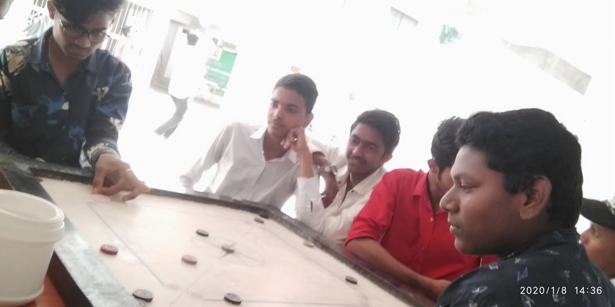 Badminton players engaged in doubles match showing athletic skill